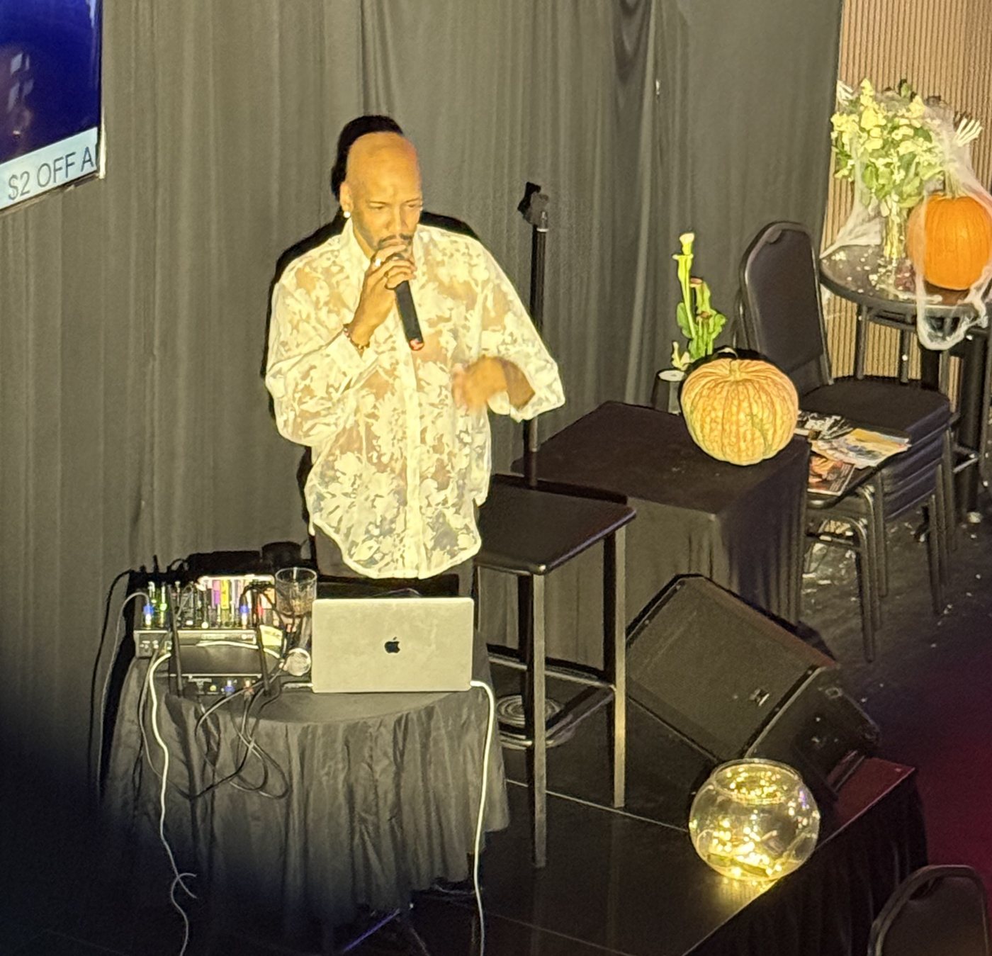 Antonio performing in a spotlight at Tap That