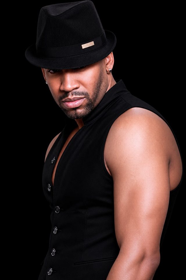 Antonio Edwards in a black fedora and vest